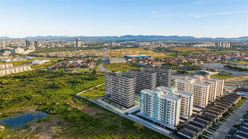 Vista aérea em 3D de conjunto de torres residenciais inserido no bairro