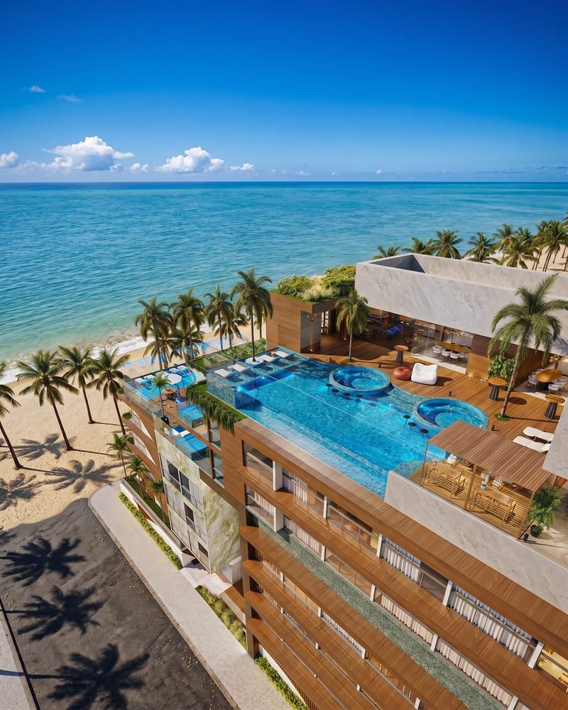 Vista aérea em 3D de rooftop com piscinas de empreendimento residencial à beira-mar
