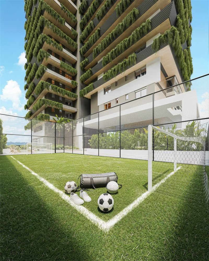 Renderização 3D do campo de futebol gramado ao pé das torres, com bolas e bolsa esportiva em primeiro plano